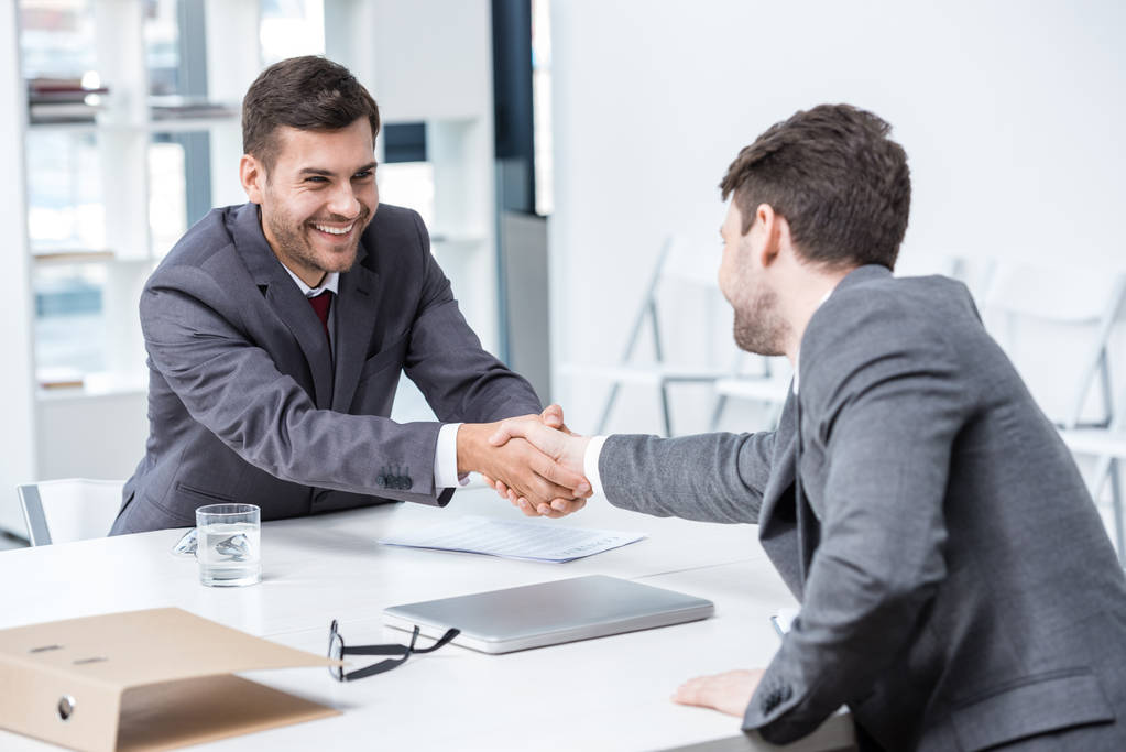 stock-photo-businessmen-shaking-hands